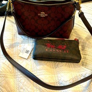 Beautiful burgundy Authentic Coach cross body purse and wristlet